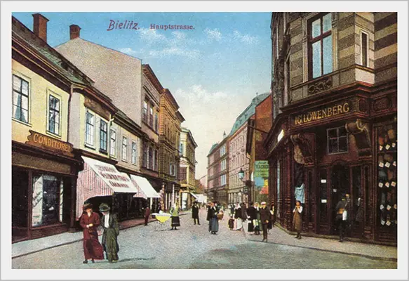 Historyczna pocztówka Bielitz Hauptstrasse z szyldem IG. Löwenberg